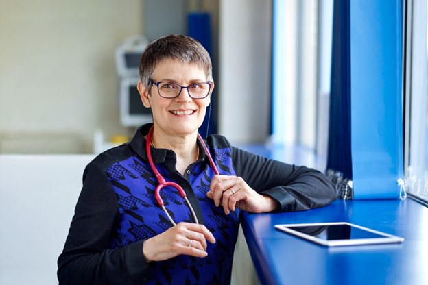 Doctor holding a stethoscope in a hospital